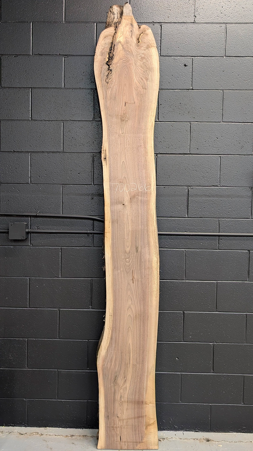 live edge walnut slab with interesting figure at the top