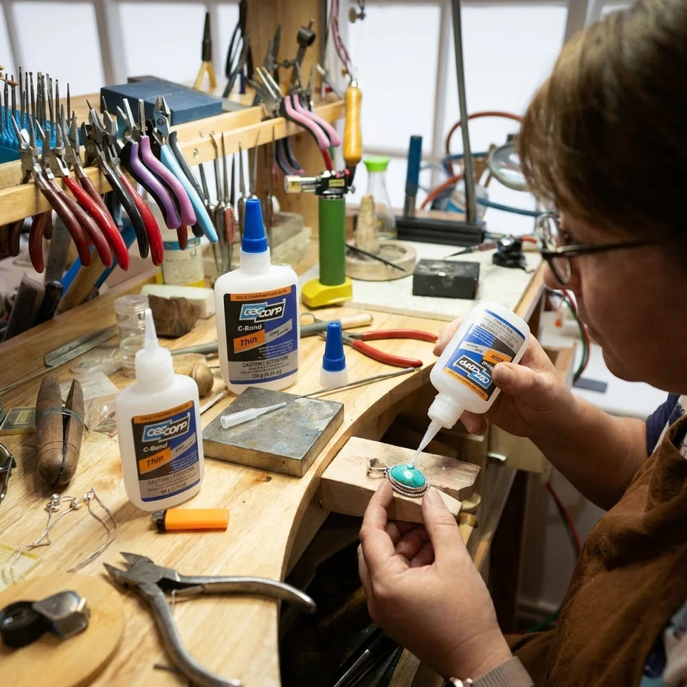 Person working with jewelry on a wooden table with tools CEC Corp C-Bond Thin 